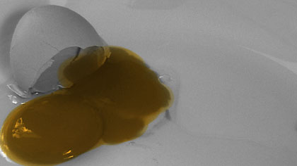 doubled up, still: Broken egg. I cut out lots of frames and painted over the top of the live action sequences to integrate them into the animated main body of work.
