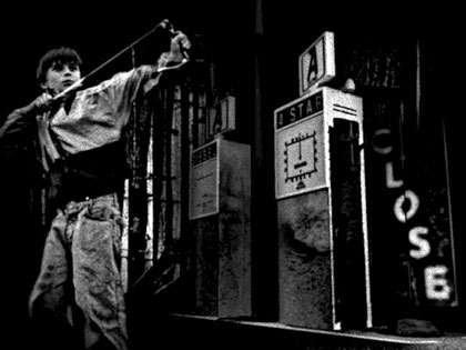End of Restriction, still: The old garage: My favourite shot from the film. It was also the first time that I learnt you could put textures onto the 3D models inside the 3D application! Up until this point I had been applying them afterwards in Photoshop!! This explains why throughout most of the film the graphics and digital noise float on top of the images and don’t really feel integrated with the scenes. To get the pictures of the children I spent the day cycling around my sister’s village (which partly inspired the film)... and I still feel guilty for telling them that if they had their picture taken they would appear in a big blockbuster film.