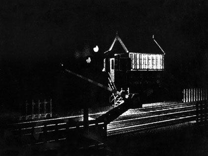 End of Restriction, still: Level crossing: The train that goes past at the level crossing was filmed by me and my brother John in the West Country (my films are always real family affairs). I was disappointed by how short the train was and it didn’t allow me time to mix in all of my London photographs over the scene. So I just looped the passing carriages. I was really chuffed to receive a letter from a train-spotter who saw the film on Channel 4 and said he loved it but was puzzled which railway line had a train with so many carriages!