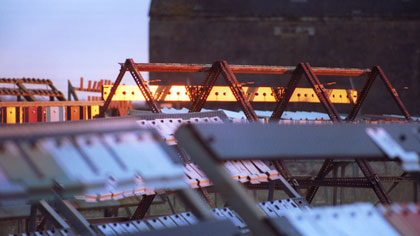 Exposure, still: Dexion glow: This image was taken about twenty minutes after sunrise, when the light of the sun is at its most acute angle. The strength and direction of the warm light has really pushed &amp; emphasized the residual colours of the old &amp; not so old metal construction.
