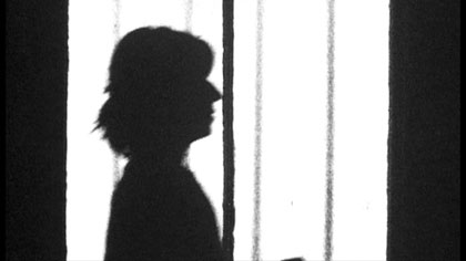 Half Life, still: Ms Szminka (Fiona Staniland) collates and files Mr Marker’s data