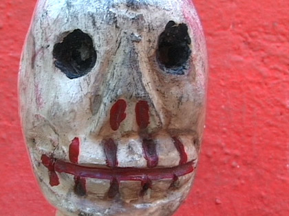 Hooked, still: Hooked skull on red