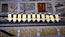 Exposure, still 5: Line on yellow plates: This shot is one of a number in the film where I mixed scratching marks made directly on to unprocessed celluloid and scanned on to my PC, with stills images of the site. In this case the scratch was a longish wavy line, scanned in reverse (dark scratch on light background) &amp; laid over images of the line on the series of yellow plates. The next step was to rub out, on PC using a software package called AURA, the points where the scratches extended beyond the plates.