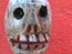 Hooked, still 9: Hooked skull on red
